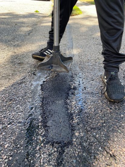 Neat driveway sealcoating job with some light patching in Shrewsbury MA