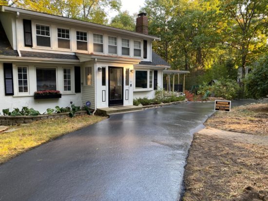 Driveway sealcoating in Millbury, Massachusetts.