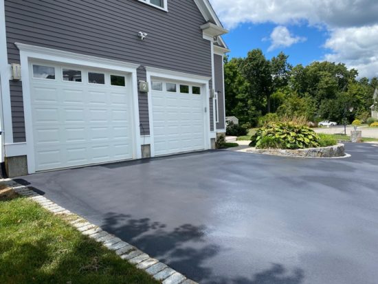 Shrewsbury MA driveway looking good after a fresh asphalt coating