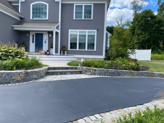 Shrewsbury MA driveway looking good after a fresh asphalt coating