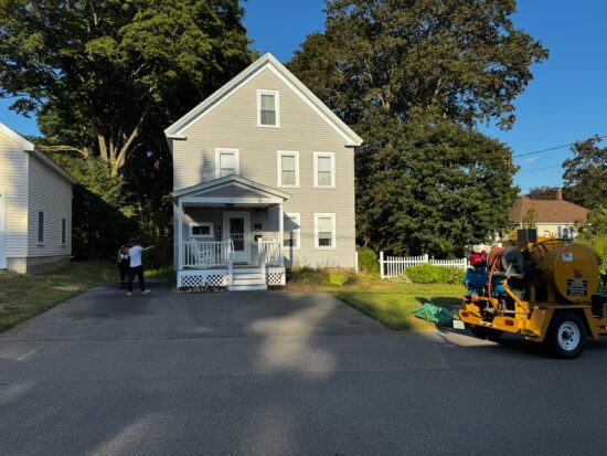 Sealcoating Two-Year-Old Driveway, Hudson MA